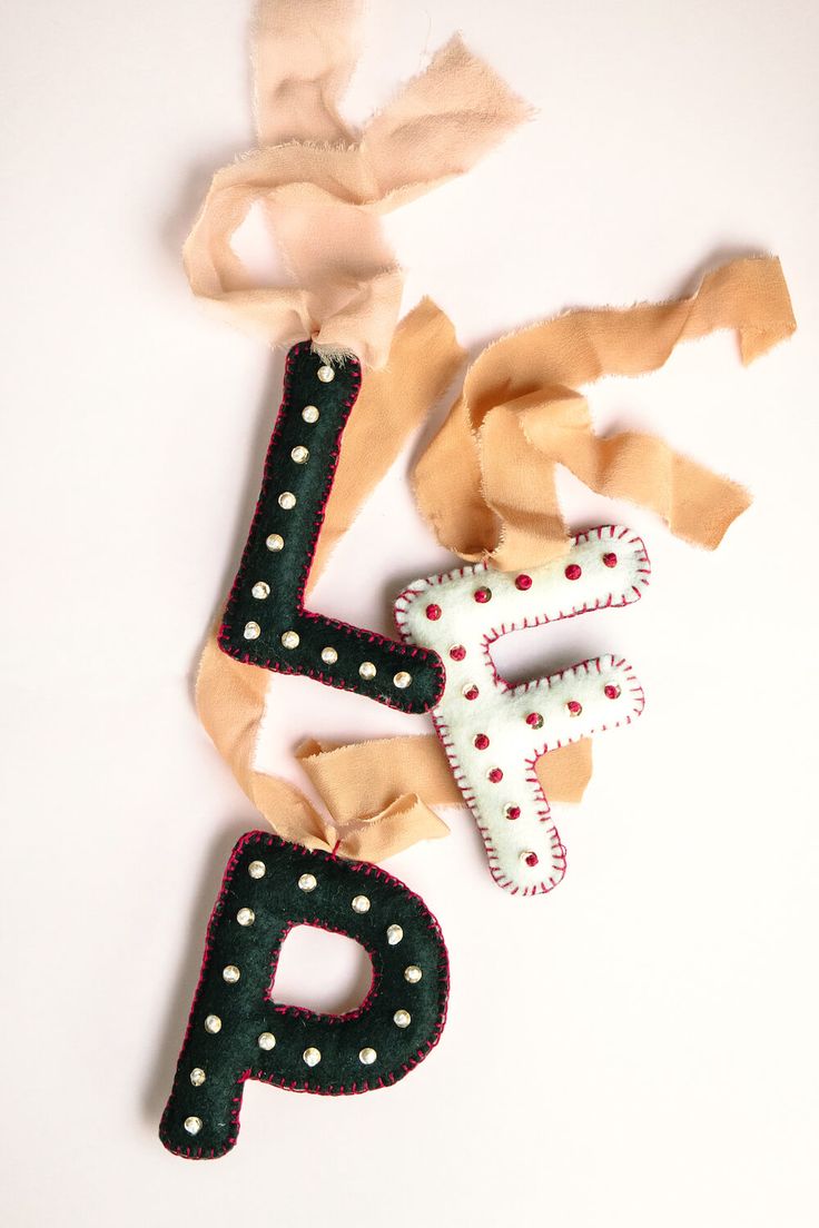 the letter p is made out of fabric and decorated with polka dotes on it