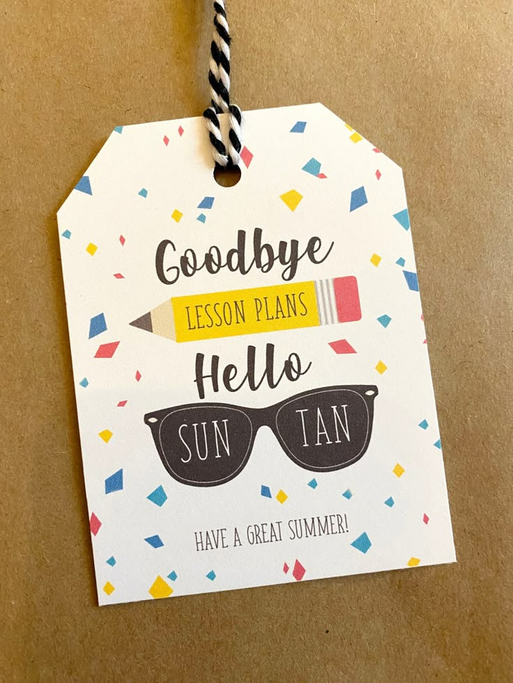 a paper tag that says goodbye lesson plans hello sun tan have a great summer on it