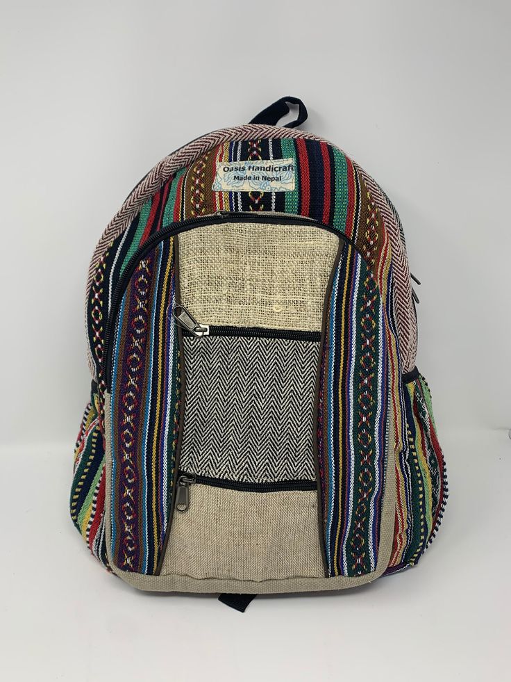 Handmade in Nepal With Pure Himalayan Hemp and Heavy Duty Cotton - Good to carry for every occasion and show off your boho / hippie side Large compartment inside with additional pockets, lots of space for your stuff and Adjustable Straps, Loop To Hang Back pack SIZE: 11 x 16 x 4 Inches, 1.5 Pounds (Approximate) Authentic Handmade Fair Trade Product from Nepal - The color and designs might vary a little due to the handmade nature. Bohemian Multicolor Backpack For School, Bohemian Multicolor Shoulder Bag For Trip, Bohemian Brown Backpack, Bohemian Backpack For Festivals, Bohemian Multicolor Backpack For Festival, Brown Bohemian School Bags, Bohemian Brown School Bag, Bohemian Brown Backpack Shoulder Bag, Multicolor Rectangular Festival Backpack