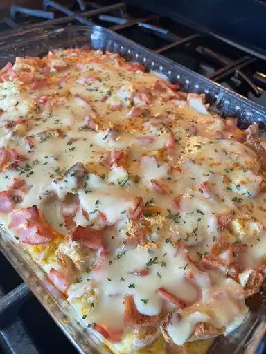 a casserole dish with meat and cheese on it