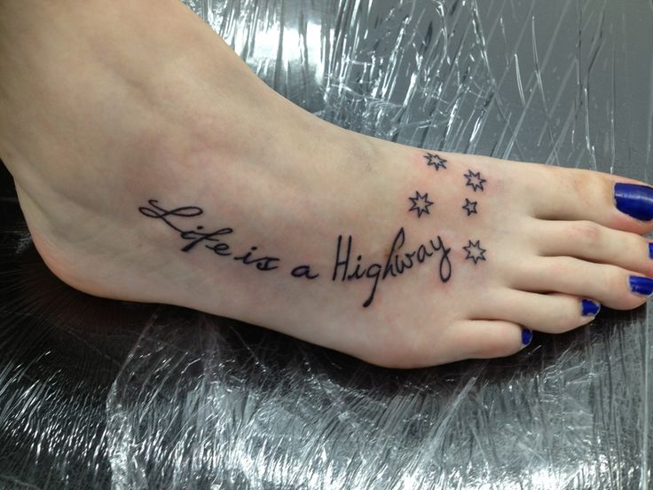 a woman's foot with a tattoo that says, life is a highway on it