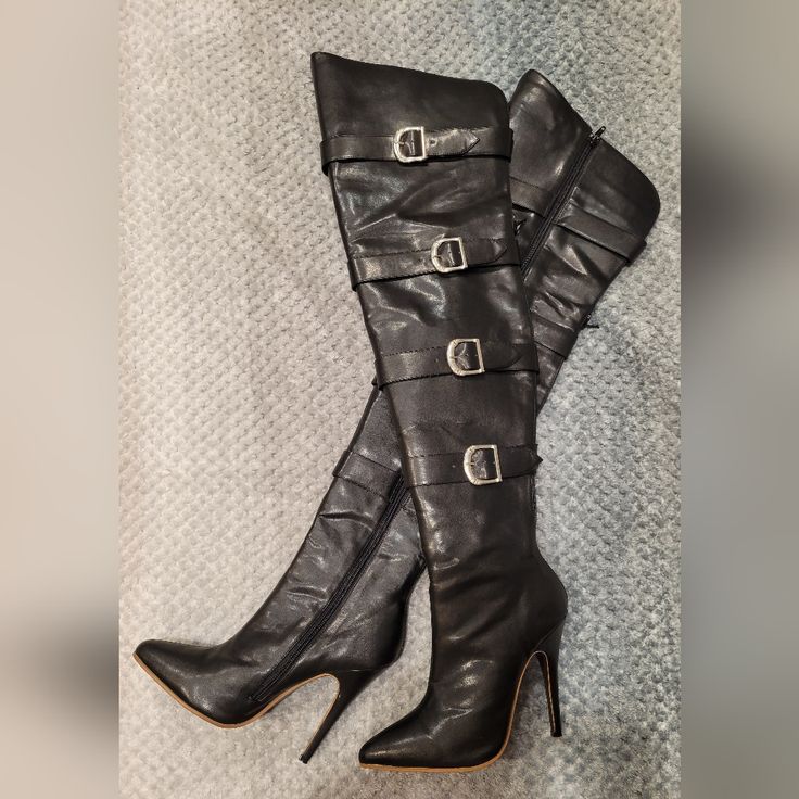 "The Highest Heel" Brand. These Black Pleather Boots Are Brand New, With No Scuffs. I Only Put Them On To Model For Them On Poshmark. Thigh High, 5 Inch Heel, Zip Side. Does Have Buckles But Really For Looks Only. Please Ask Questions If You Have Them. Thank You For Looking In My Closet. All Items Will Come From My Non-Smoking, Dog Friendly Home. Fitted Knee-high Heeled Boots With Buckle Closure, Fitted Knee-high Heeled Boots With Buckle, Black Buckle Closure Knee-high Boots For Party, Knee-high Boots With Buckle Closure For Night Out, Fitted Heeled Boots With Buckle Closure For Party, Black Buckle Boots, Buckle Boots, 5 Inch Heels, Black High Heels