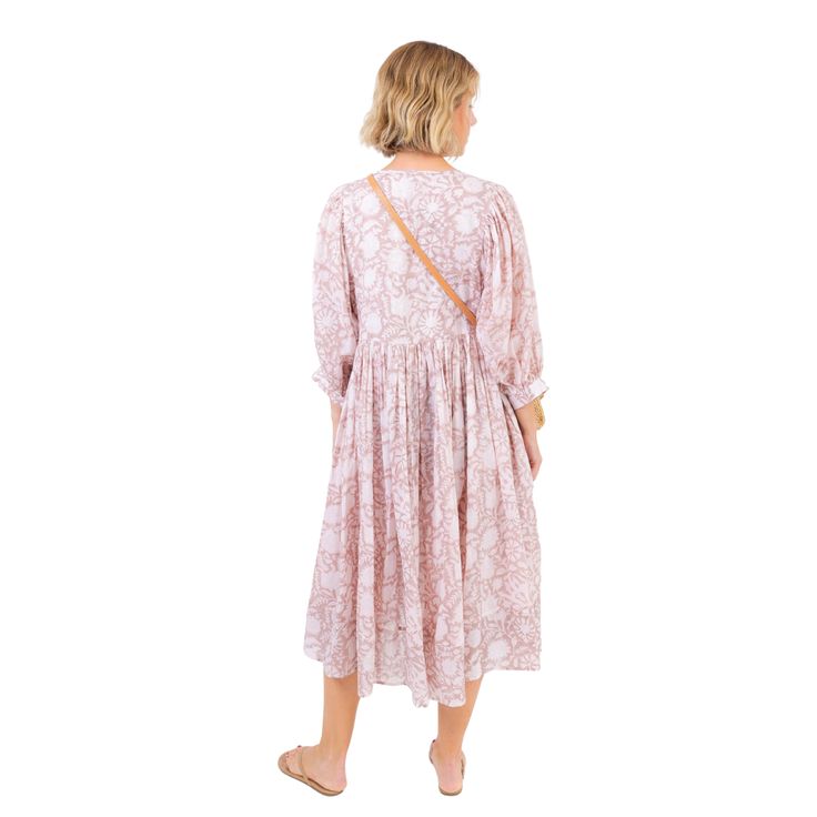 Our Beach Dress is both comfy and cute for beach days and summer nights. We love the all over subtle floral print that is both feminine and a little boho! Product Overview: Material: 100% Cotton Measurements: Front: 43", Back: 44.5", Neck: 7.25", Shoulder: 13.25" Hand Wash Separately in Cold Water Flowy Bohemian Boho Dress For Daywear, Casual Cotton Floral Dress For Vacation, Bohemian Maxi Dress With Floral Print In Relaxed Fit, Bohemian Flowy Beach Dress For Daywear, Casual Boho Dress For Garden Party, Boho Print Midi Dress For Day Out, Casual Boho Print Midi Dress For Beach, Bohemian Floral Print Relaxed Dress, Bohemian Floral Print Relaxed Fit Dress