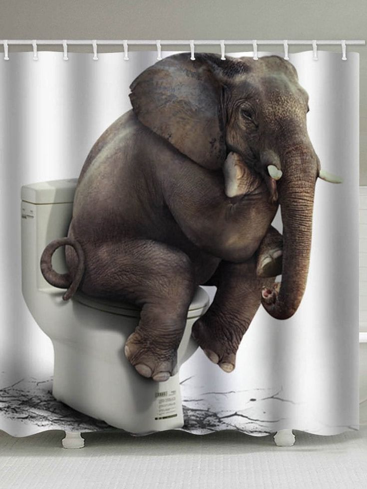 an elephant sitting on top of a toilet in front of a shower curtain with the lid up