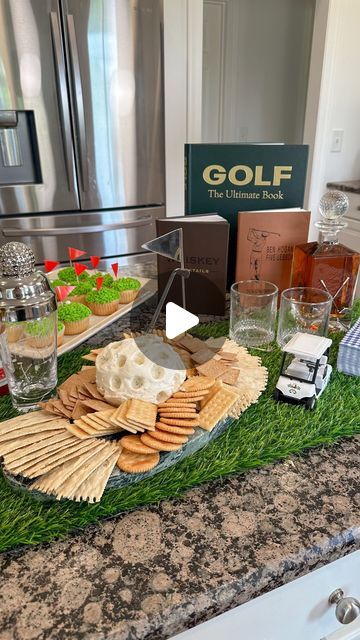 an assortment of appetizers and snacks are on the counter in front of a refrigerator