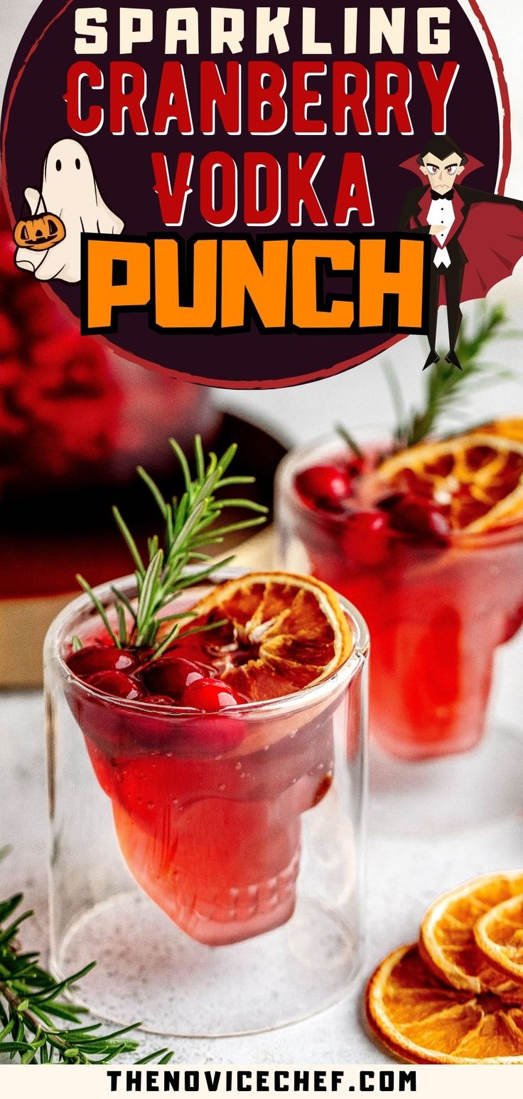 two glasses filled with cranberry vodka punch and garnished with orange slices