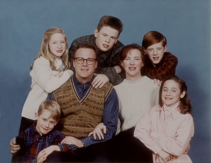 an old photo of a family posing for a picture