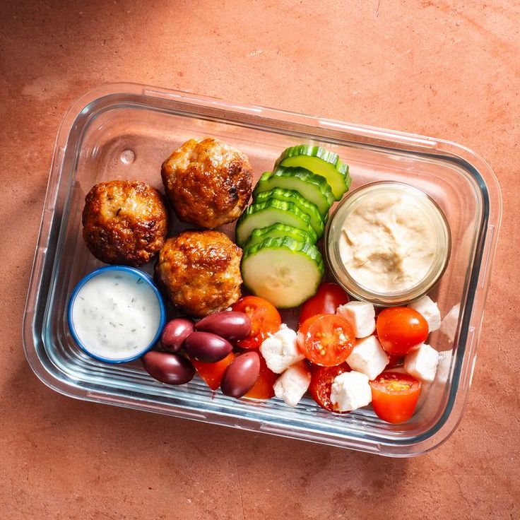 a plastic container filled with different types of food