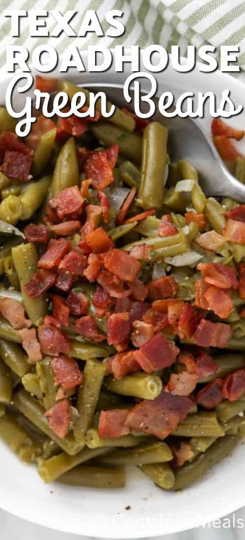 green beans with bacon in a white bowl on top of a checkered table cloth