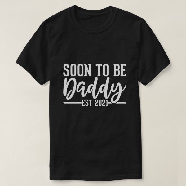 a black t - shirt that says soon to be daddy est 2012