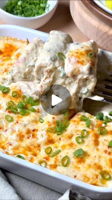 a casserole dish is being served with a fork