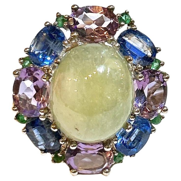 Bochic "Orient” Lemon Sapphire & Multi Gem Cocktail Ring In 18K Gold & Silver Natural Lemon Sapphire Cabochon - 7 Carat Natural Tanzanites - 4 Carat Natural Amethyst - 4 Carat Natural Emeralds - 1 Carat This Ring is from the "Orient" traveling collection are the epitome of elegance and versatility. It offers a perfect blend of day to night and swimwear to evening wear, allowing you to effortlessly transition between different occasions and outfits. Wearing these spectacular oriental-style ring will undoubtedly make you the center of attention. It addw a touch of glamour and sophistication to your favorite caftans, swimwear, or evening attire, enhancing your overall look. The "Orient" collection, from which this ring originates, showcases exceptional craftsmanship and incorporates natural g Sapphire Cabochon, Tanzanite Stone, Modern Ring, Yellow Sapphire, Evening Attire, Natural Emerald, Cocktail Ring, 1 Carat, Modern Jewelry