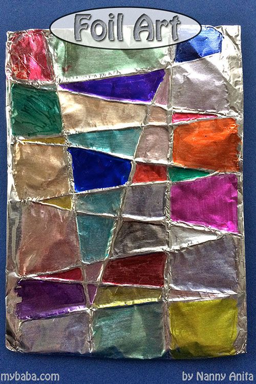 an art project made out of aluminum foil and colored paper with the words foil art on it