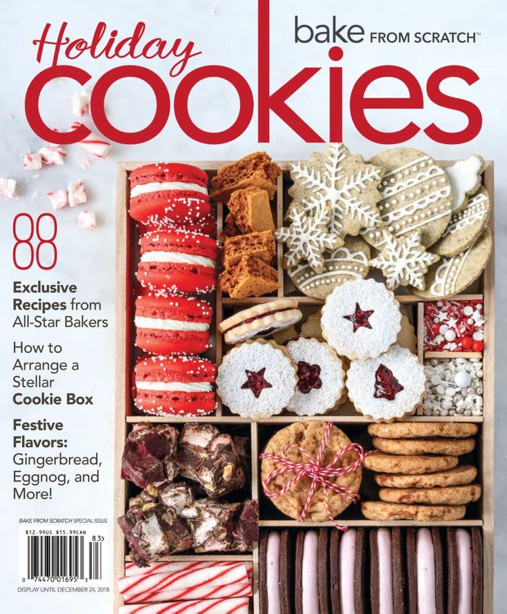 the front cover of holiday cookies magazine, with an assortment of cookies in a wooden box