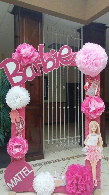 a barbie birthday decoration with pink and white flowers