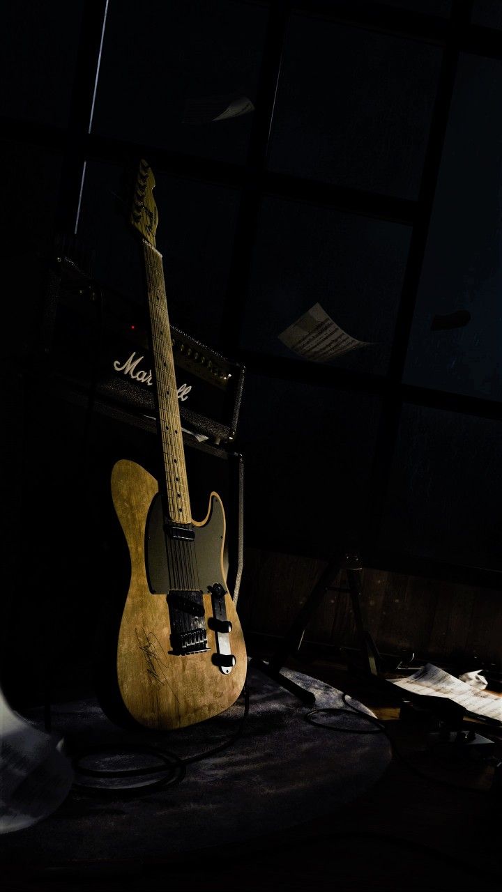 an electric guitar sitting on top of a table