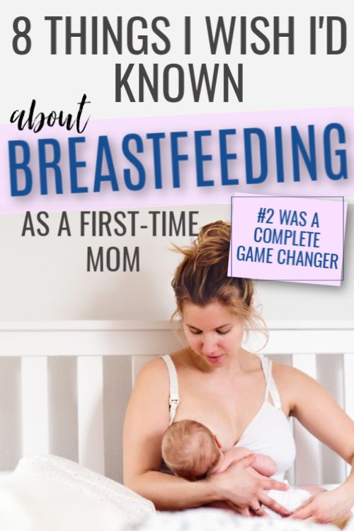 a woman holding a baby in her arms with the text 8 things i wish i'd known about breastfeeding as a first - time game changer