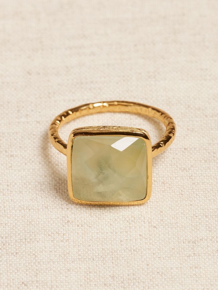 FACETED GEMSTONES: A tempting array of treasures, this collection pairs semi-precious gems with 22k gold-plated brass to highlight the stones' natural beauty and faceted cut.  Featuring brilliant labradorite, shimmering moonstone, and pearlescent prehnite.  The standout Square Facet ring is handmade from gold-plated 22k gold with a finely hammered bezel and comfortable rounded, hammered band. 40s Style, Teacher Clothes, Faceted Ring, Hammered Band, Semi Precious Gems, Nail Jewelry, 2022 Fashion, Fashion Wishlist, Precious Gems