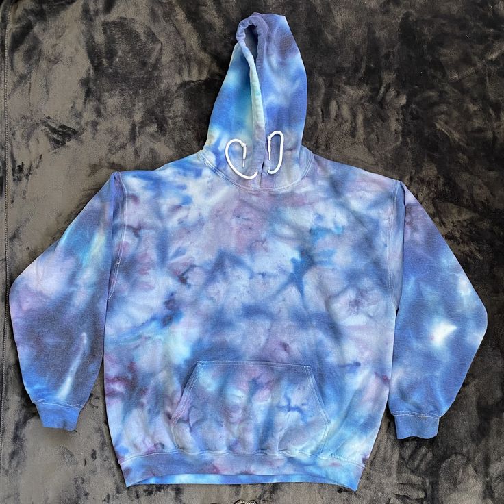 a tie dye hoodie with scissors on it