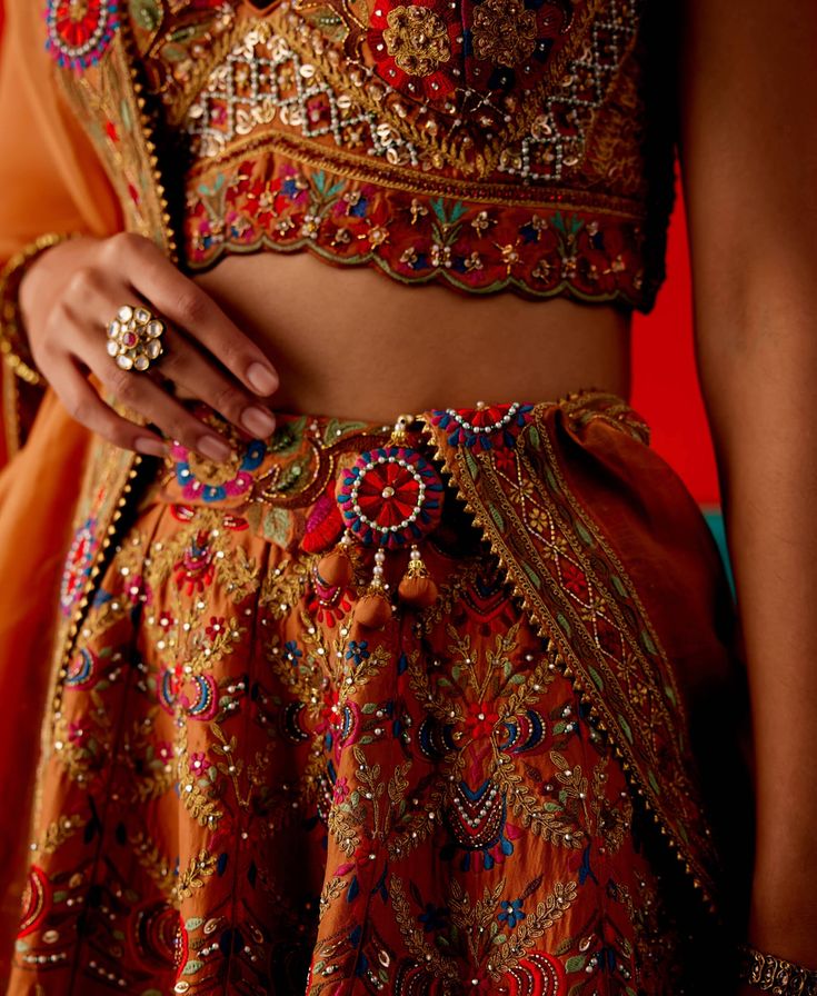 Elevate your style in this cider lehenga set, featuring exquisite floral thread embroidery highlighted by various embellishments. The set is paired seamlessly with an embroidered blouse and dupatta, creating a stunning ensemble that exudes sophistication and is perfect for special celebrations. Dull Orange, Floral Thread Embroidery, Personal Shopping Service, Embroidered Lehenga, Dupion Silk, Thread Embroidery, Silk Organza, Bridal Couture, Indian Design