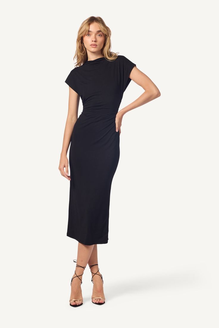 Embrace effortless elegance with the Mesa Sand Washed Slouchy Mock Neck Midi Dress. Crafted from soft, sand washed fabric, this dress features a relaxed, slouchy fit that drapes beautifully while offering all-day comfort. The mock neck adds a touch of refined sophistication, while the midi length ensures versatility for both casual and elevated occasions. In classic black, the Mesa Dress is the perfect blend of understated luxury and modern style, making it a timeless addition to any wardrobe. 9 Mock Neck Midi Dress, Cable Knit Dress, Understated Luxury, Midi Dress Black, Summer Sweaters, Sweater Collection, Effortless Elegance, Midi Length Dress, Black Midi Dress