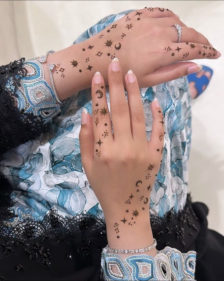 a woman with tattoos on her arms and hands