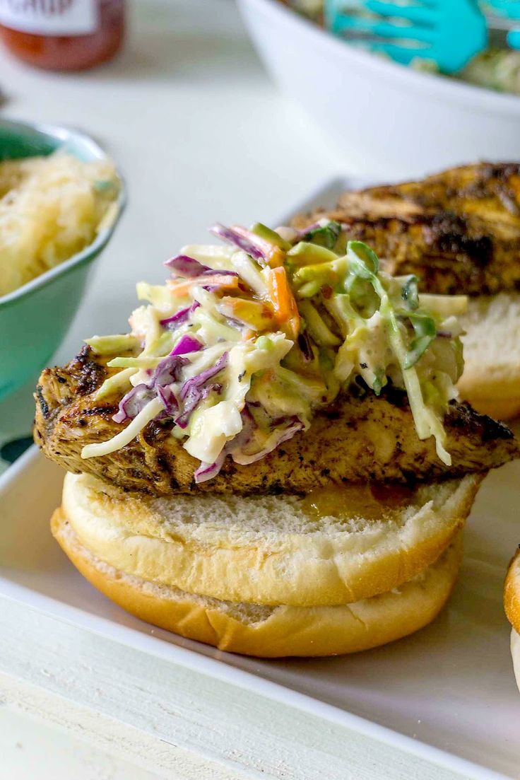 a chicken sandwich with cole slaw on it