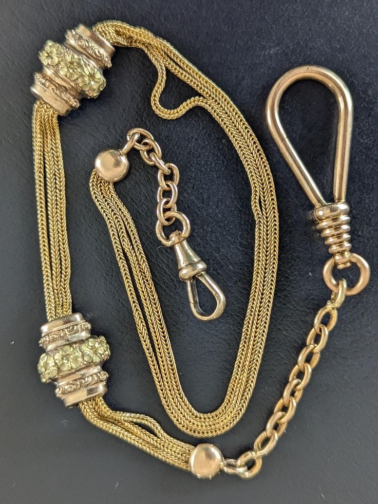 Antique Napoleon III/Victorian 18k Gold Watch Chain, Guard Chain Necklace, Dog Clip Clasp on Both Ends, The Plus is that the larger one is Swivel, and Very Rare with such a large size. It is made of 18k 3 tone gold, and hallmarked multiple times with an eagle's head - French hallmark for 18k guarantee. The multiple curb chains in the middle are yellow tone, the larger chain on both ends that hold the multiple chain are pink tone, and last but not least, the charms are pink tone adorned with small flowers chiseled in an almost green tone. This kind of chain is very rare, especially nowadays, it is almost unique. This chain is perfect for combining and mixing with other chain pendants and charms. It can be dressed up in a fun way in many different styles. Show off your refined, or chic and r Chunky Dog, Victorian Watch, Yellow Tone, Dog Clip, Napoleon Iii, Eagle Head, Antique Necklace, Yellow Tones, Chatelaine