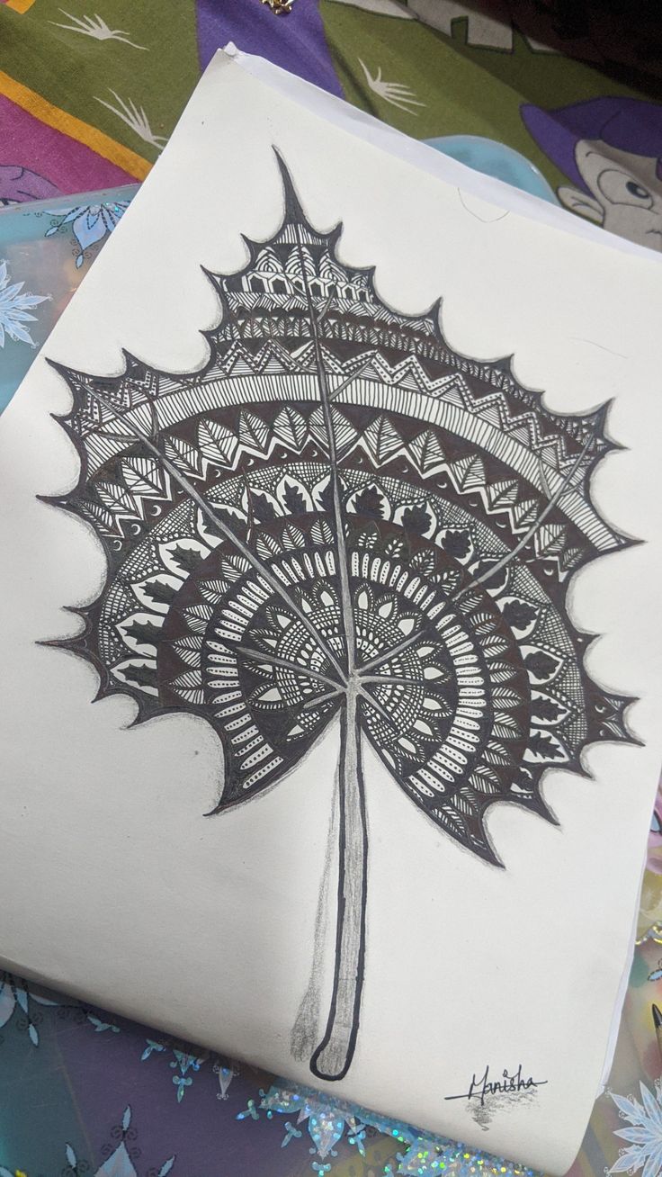 a drawing of a leaf with intricate designs on it