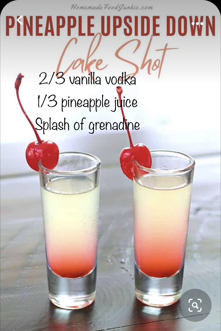 two glasses filled with liquid and topped with a cherry