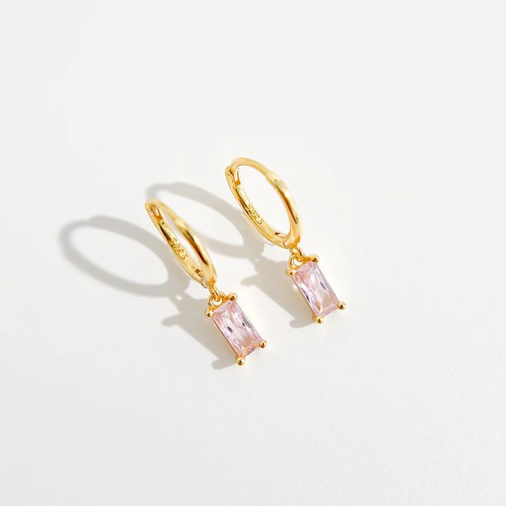 Pink Rectangle Huggies in Gold | Flaire & Co. Pink Gold-plated Jewelry Tarnish Resistant, Pink Tarnish Resistant Gold Plated Jewelry, Pink Gold-plated Tarnish-resistant Jewelry, Pink Tarnish-resistant Gold-plated Jewelry, Tarnish Resistant Pink Gold Plated Jewelry, Rectangular Gold Plated Fine Jewelry, Gold Plated Rectangular Fine Jewelry, Rectangular Shaped Gold Jewelry In Fine Jewelry Style, Pink Dainty Huggie Jewelry