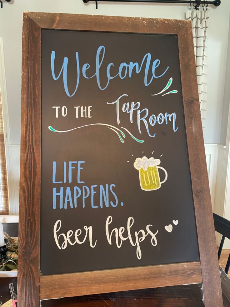 a sign that says welcome to the tap room and life happens beer hops on it