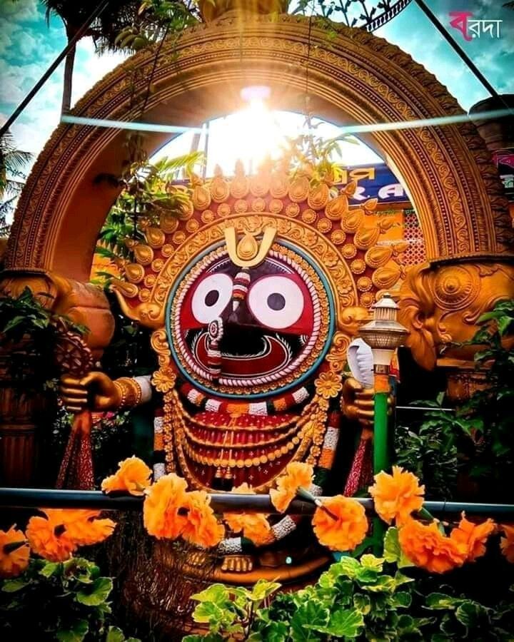 an idol is displayed in front of some flowers and trees with the sun shining through it