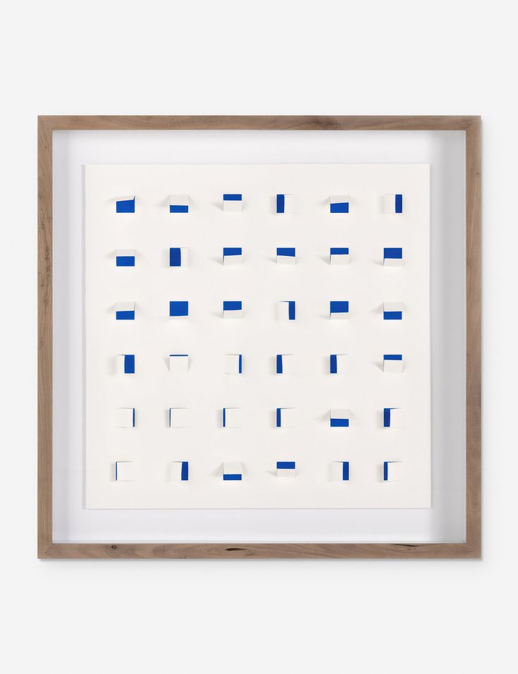 a white frame with blue squares on the bottom and one square in the middle, against a white wall