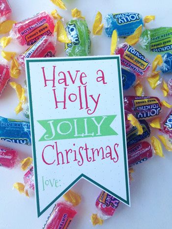 some candy is laying on top of each other with the words have a holly jolly christmas