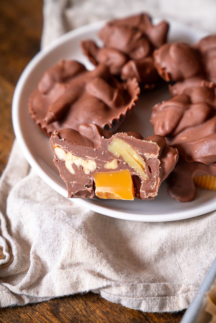 a white plate topped with pieces of chocolate