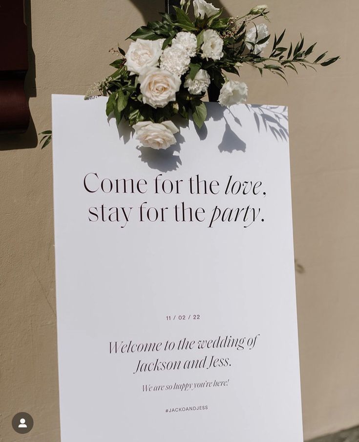 a white sign with flowers on it that says, come for the love stay for the party