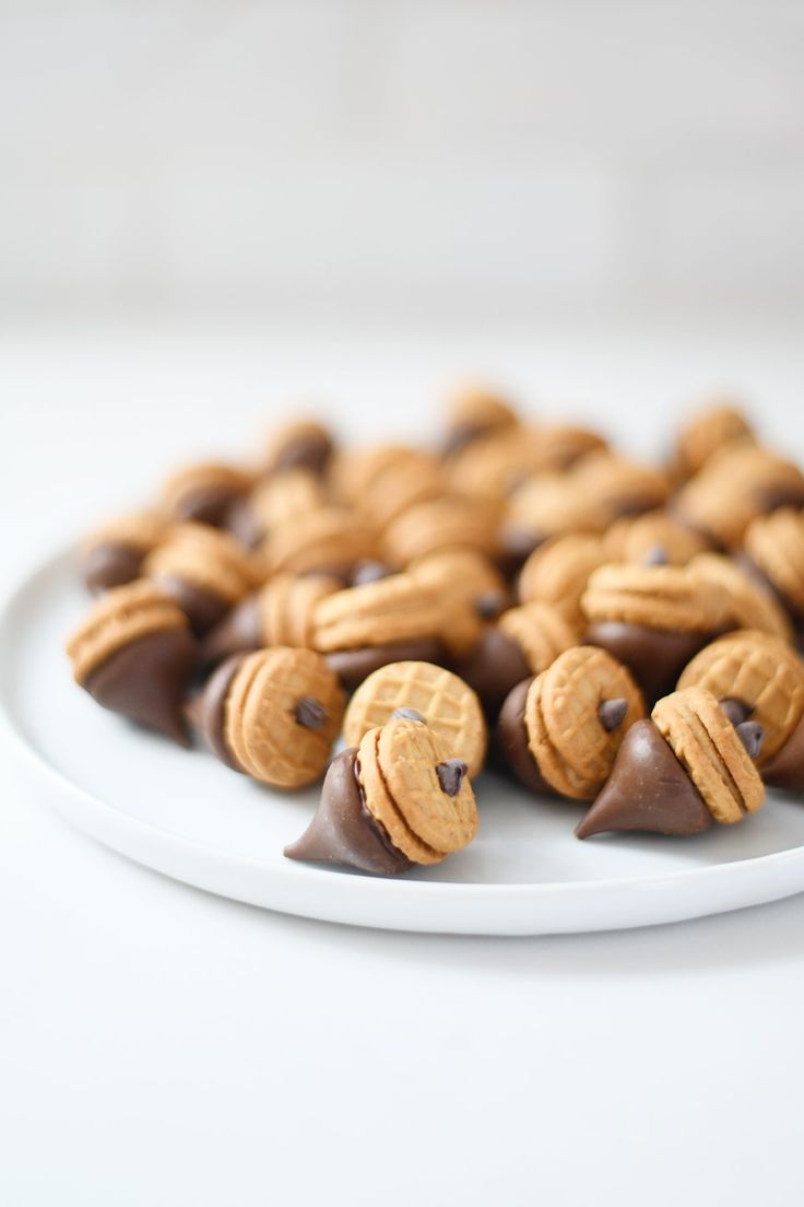 chocolate covered almonds on a white plate