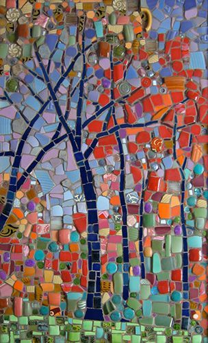 a tree made out of colorful glass tiles