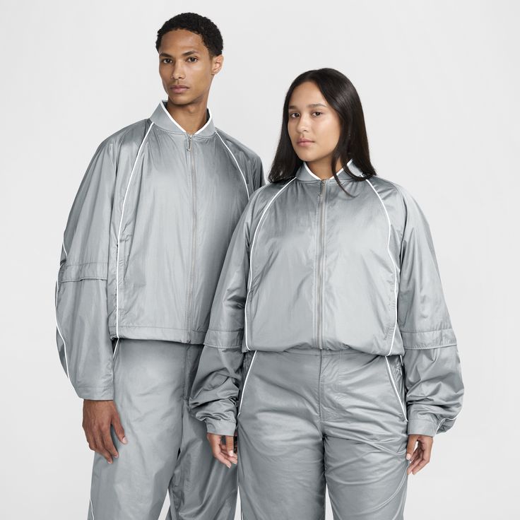 French designer Simon Porte Jacquemus and Nike team up to create and curate another collection. Clean, crisp and classic, this track jacket borrows some iconic design lines while bringing its own modern flair. The roomy sleeves and boxy cut keep the sporty look with a fresh, relaxed feel. It's fully equipped with water-repellent and wind-resistant crinkled nylon fabric to help you stay dry while cool mesh lining offers breathability. Nike X Jacquemus, Simon Porte Jacquemus, Tracksuit Jacket, French Designer, Iconic Design, Louis Vuitton Shoulder Bag, Nylon Fabric, Sporty Look, Track Jacket