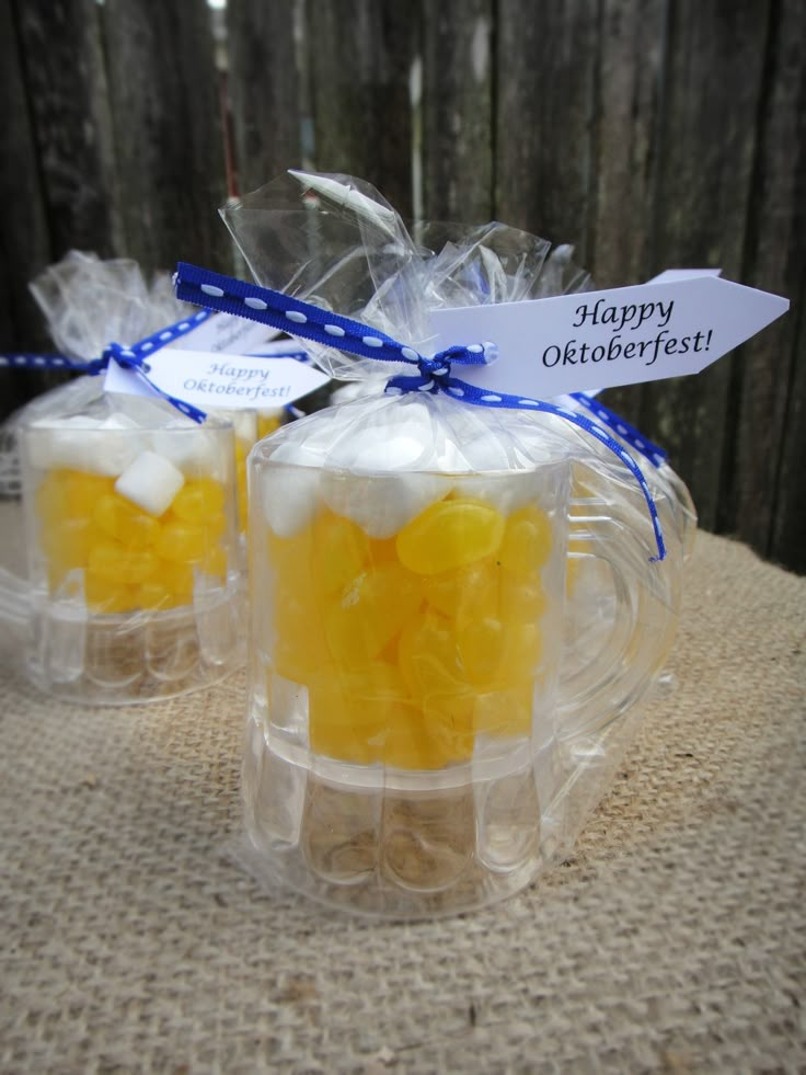 two clear bags filled with yellow and white candies on top of a burlock