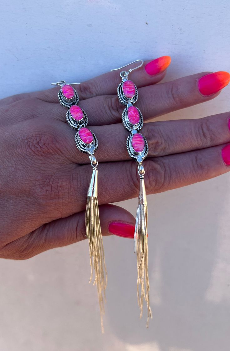 These Fringe Barbie Drop Earrings make any outfit stand out. Crafted from cultured pink, these fringe earrings are sure to add a dash of style to your wardrobe. An exciting take on traditional earrings, these pieces will help you make a statement. Sterling silver and made in the USA! Sterling Silver Chandelier Earrings With Dangling Beads, Pink Bohemian Drop Earrings, Bohemian Pink Drop Earrings, Traditional Fringe Drop Earrings, Sterling Silver Earrings With Dangling Beads, Traditional Fringe Dangle Jewelry, Festive Beaded Latkan Earrings, Pink Tassel Drop Earrings With Dangling Beads, Pink Linear Earrings For Pierced Ears