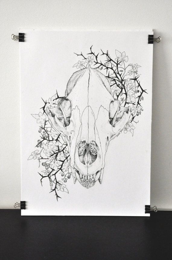 a black and white drawing of a deer's skull with flowers on its head