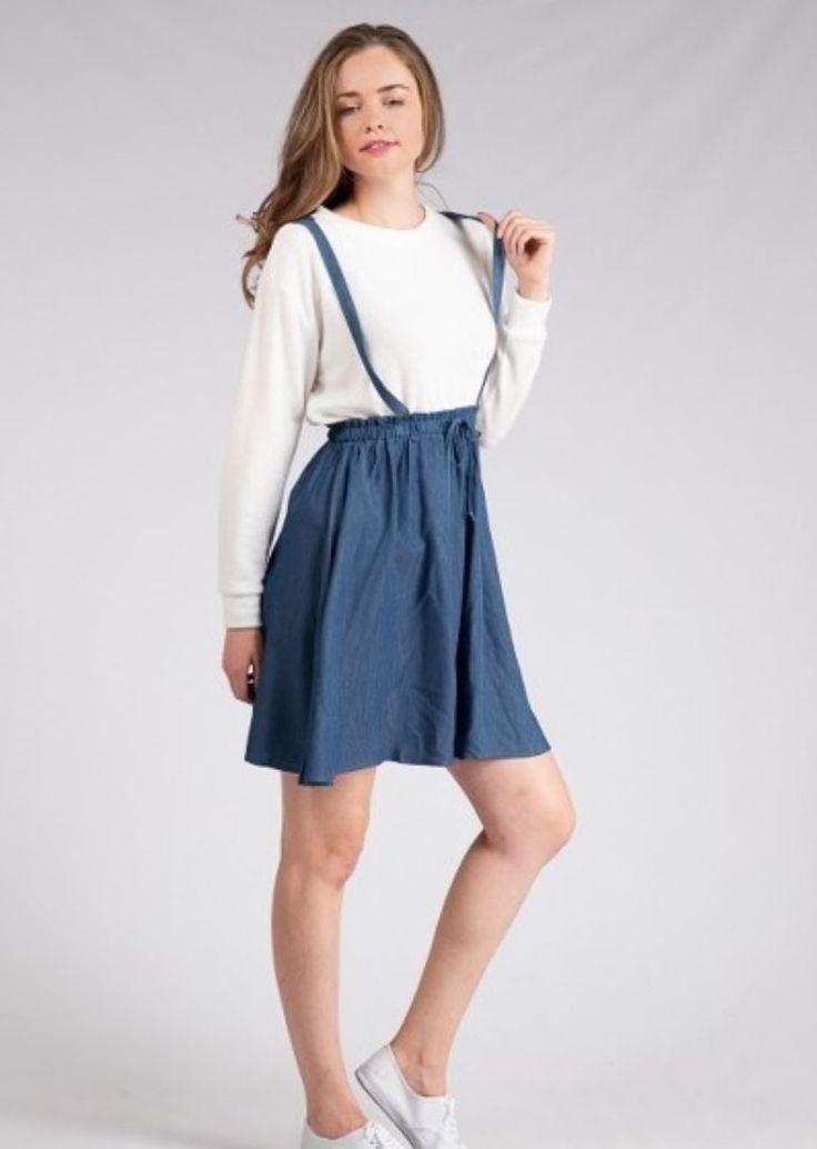 This adorable overall skirt is the perfect comfy, casual piece! It has a cinched waist with a tied string in the front, and an A-line cut skirt. Model is wearing a small. 100% rayon *Free shipping & returns on orders over $50! Casual Spring Suspender Dress With Tie Straps, Casual Mini Suspender Dress For Day Out, Casual Dress With Relaxed Skirt For Daywear, Casual Spring Suspender Dress For Day Out, Casual Spring Sundress With Flowy Skirt, Casual Flowy Sundress For Spring, Casual Flowy Spring Sundress, Casual Tie-back Sundress, Casual Suspender Dress For Spring Daywear