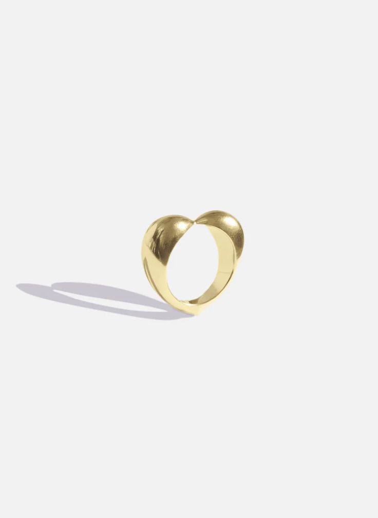 The Éternal Cloud Ring is crafted in 18K gold that captures the spirit of an iconic symbol balancing symmetry and substance. A bold sculptural heart that can be worn and cherished. Timeless Brass Ring Perfect As A Gift, Timeless Brass Ring As Gift, Timeless Brass Ring Gift, Timeless Brass Ring Perfect For Gifts, Timeless Brass Ring For Gift, Yellow Gold Brass Rings For Anniversary, Luxury Wedding Ring With Unique Design, Yellow Gold Rings With Unique Design For Wedding, Anniversary Brass Dome Ring