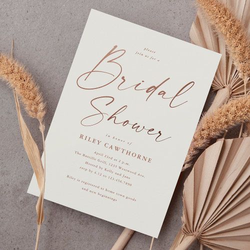 the bridal shower card is next to some dried flowers and an umbrella on top of it