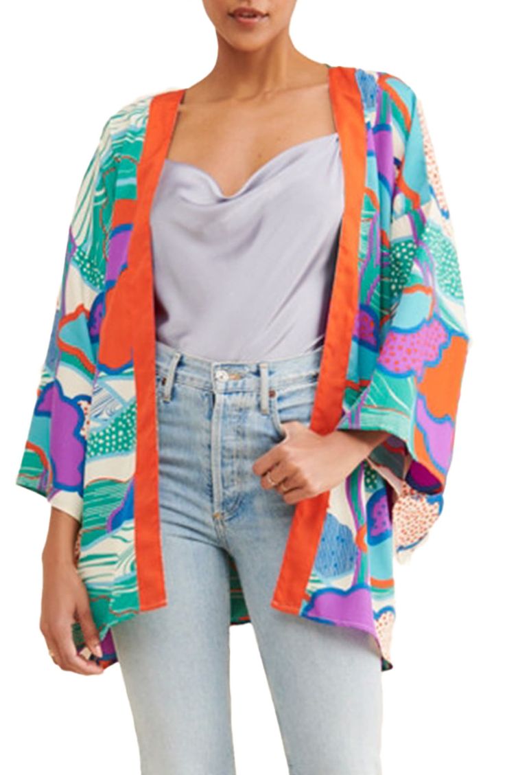 Top off your look with this lightweight ruana framed by loose-fitting sleeves and patterned with a colorful print. 100% polyester Hand wash, line dry Imported Oversized Multicolor Wrap Kimono, Multicolor Floral Print Open Front Outerwear, Multicolor Open Front Outerwear With Floral Print, Oversized Printed Spring Outerwear, Printed Oversized Outerwear For Spring, Oversized Printed Outerwear For Spring, Multicolor Floral Outerwear With Kimono Sleeves, Multicolor Outerwear With Floral Print And Kimono Sleeves, Multicolor Printed Outerwear With Kimono Sleeves