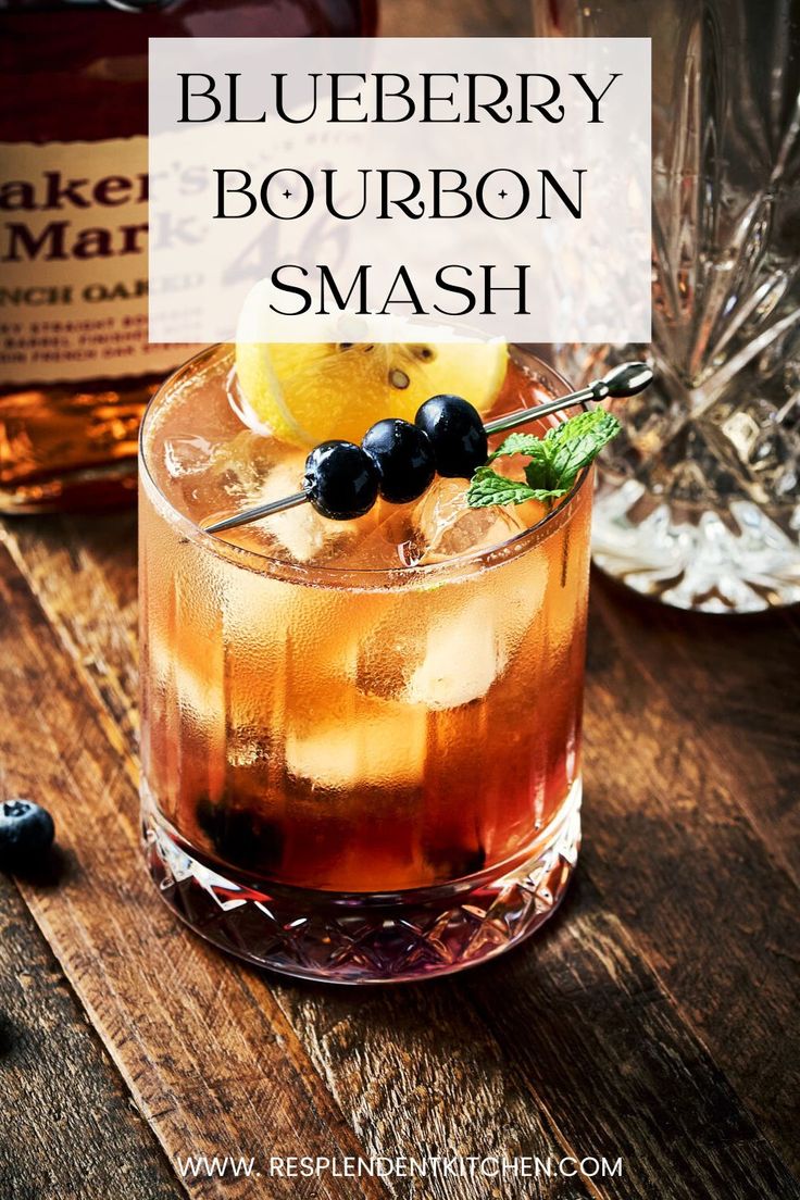 the blueberry bourbon smash is served in a glass with ice and garnish