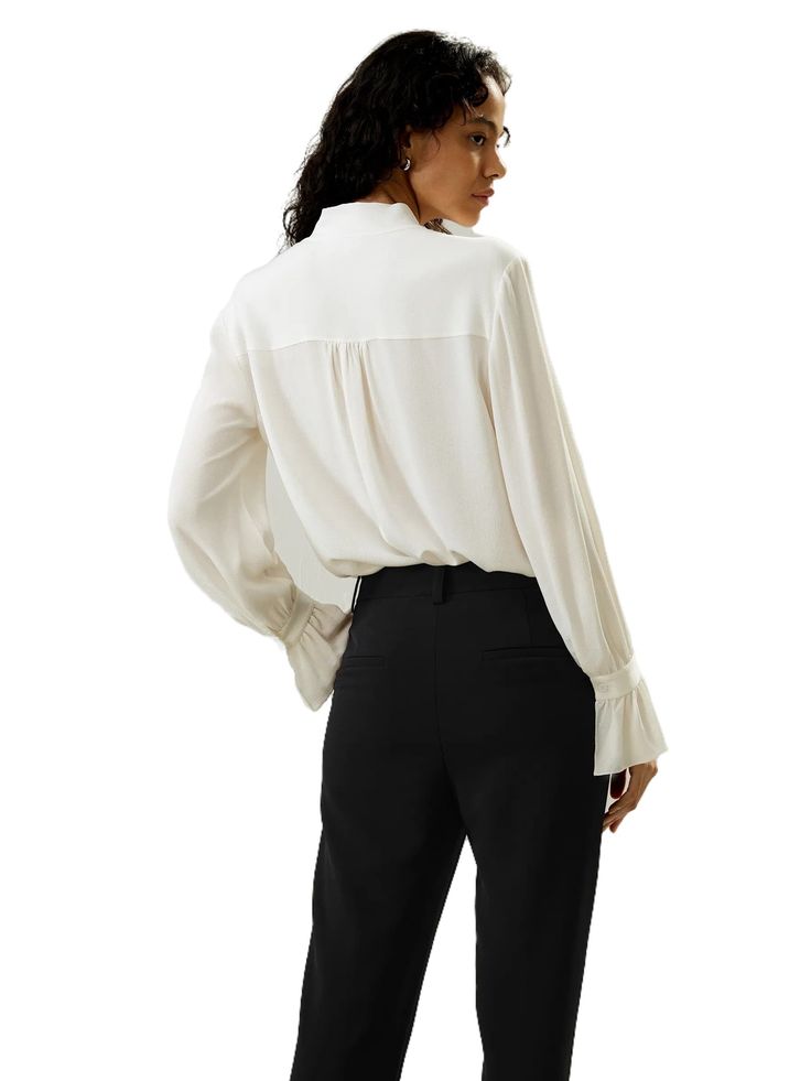 The palace pleat design on the cuffs adds an extra element of sophistication, creating an atmosphere of refined elegance. Whether it's for work or casual outings, this blouse is versatile and suitable for any occasion. 23MM Ghost Crepe V-neck Neckline ribbon Pleated cuffs Suitable for casual work and vacations Elegant V-neck Top With Cuffed Sleeves, Elegant V-neck Blouse For Office, Elegant Formal Blouse With Gathered Sleeves, Chic Blouse With Bishop Sleeves, Classic Office Blouse With Gathered Sleeves, Elegant V-neck Top With Button Cuffs, Feminine Blouse With Gathered Sleeves For Formal Occasions, Feminine Formal Blouse With Gathered Sleeves, Formal Feminine Blouse With Gathered Sleeves