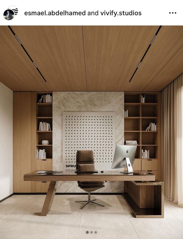 an office with a desk, chair and bookshelf in the middle of it